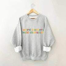 Sweat-shirt Des enseignants étranges construisent des personnages