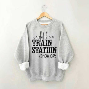 Pourrait être un sweat-shirt un peu de jour à la gare
