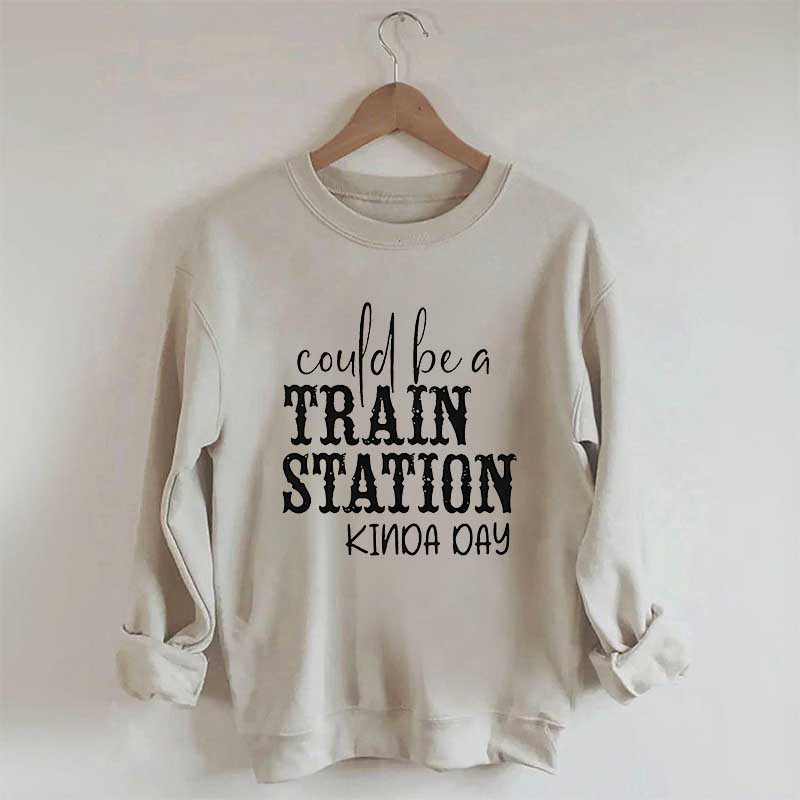 Pourrait être un sweat-shirt un peu de jour à la gare