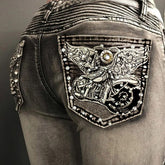 Vintage Slim Jeans mit bestickten Taschen