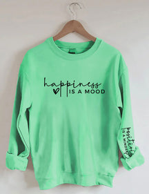 Le bonheur est une humeur, la positivité est un sweat-shirt d’état d’esprit
