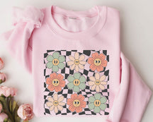 Sweat-shirt visage fleurs à carreaux