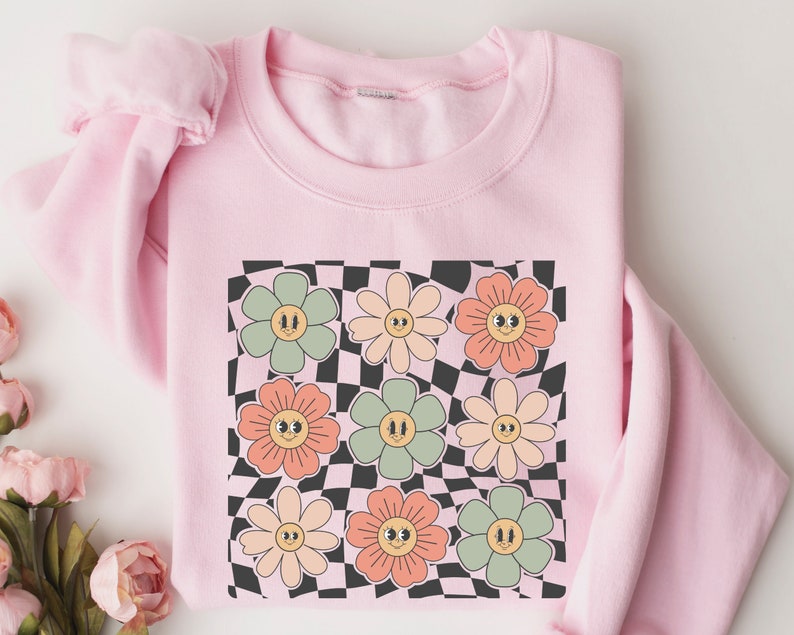 Sweat-shirt visage fleurs à carreaux