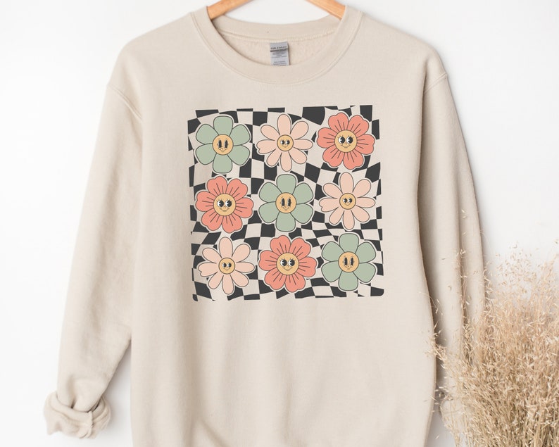 Sweat-shirt visage fleurs à carreaux