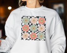 Sweat-shirt visage fleurs à carreaux
