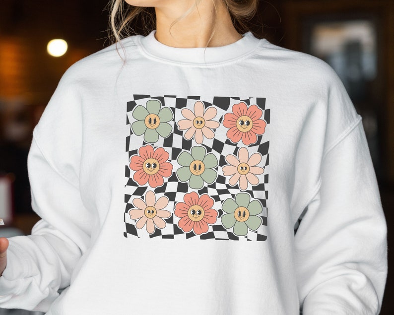 Sweat-shirt visage fleurs à carreaux