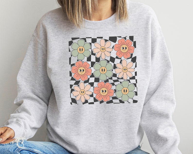 Sweat-shirt visage fleurs à carreaux